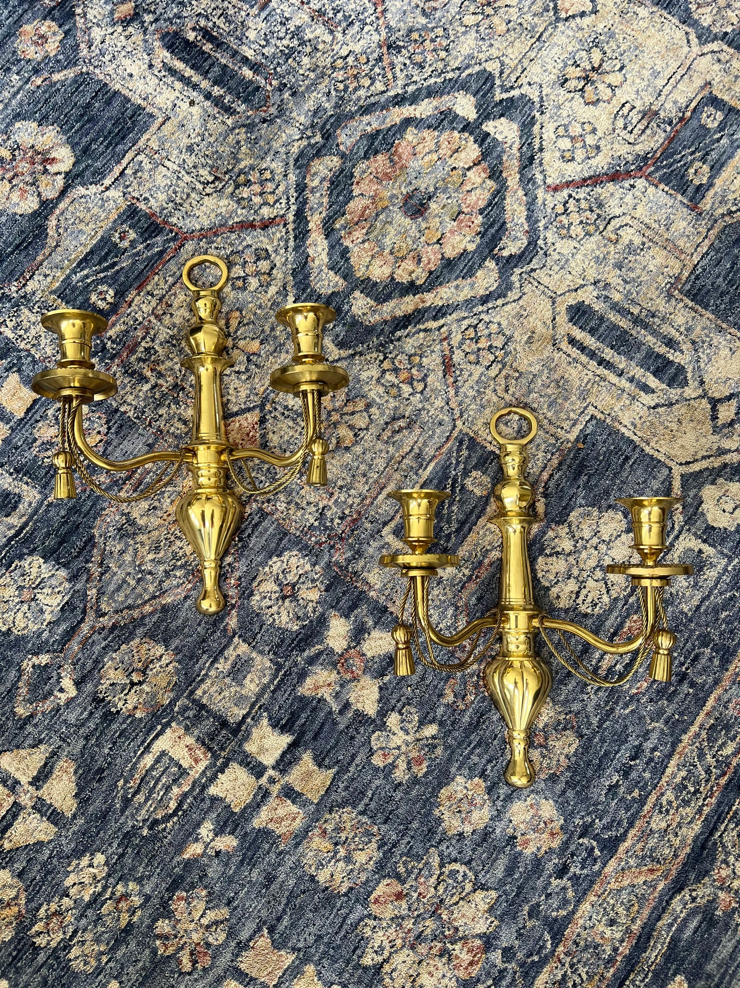 Pair of double arm brass braid and tassel candelabra wall sconces