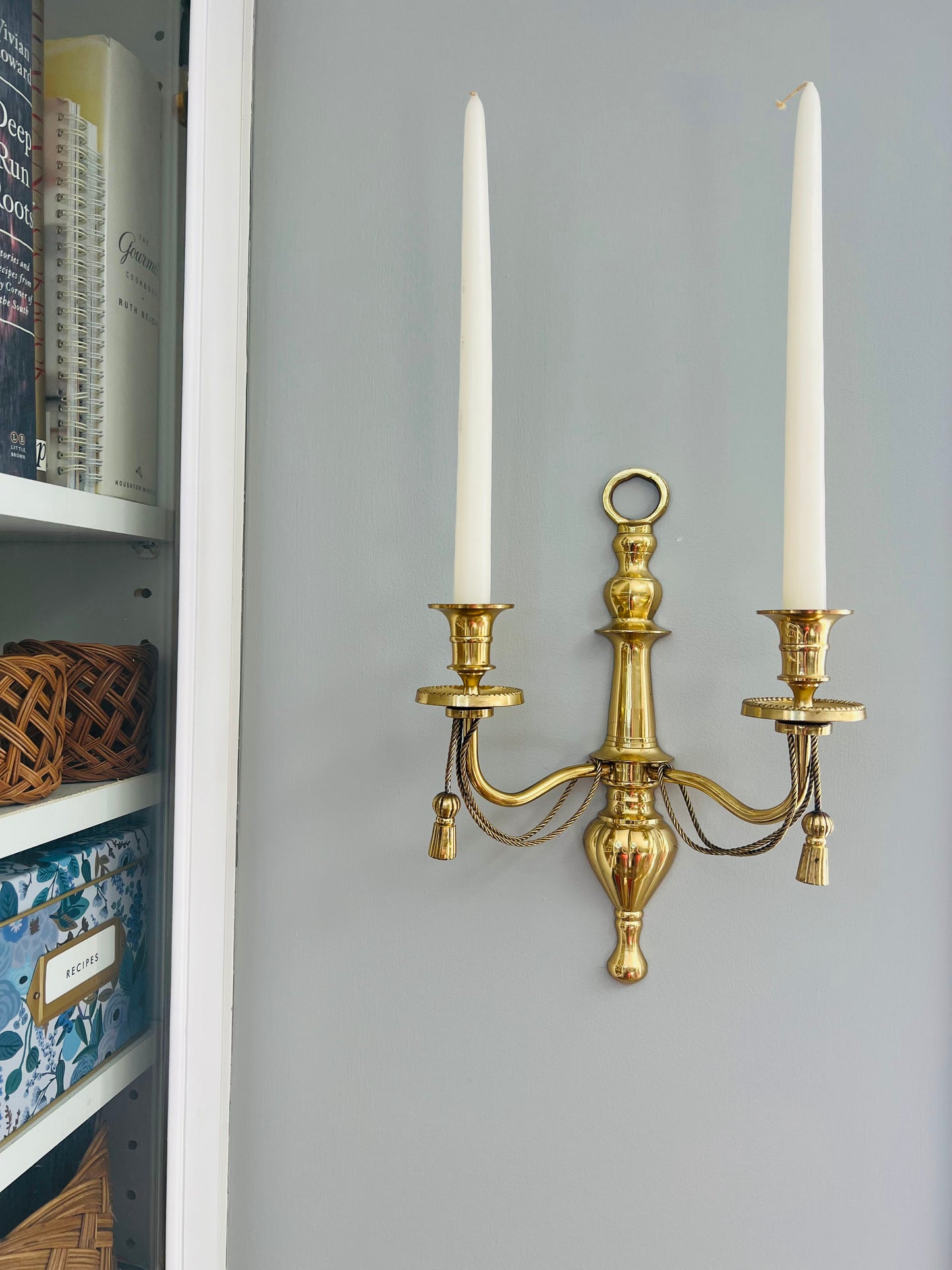 Pair of double arm brass braid and tassel candelabra wall sconces