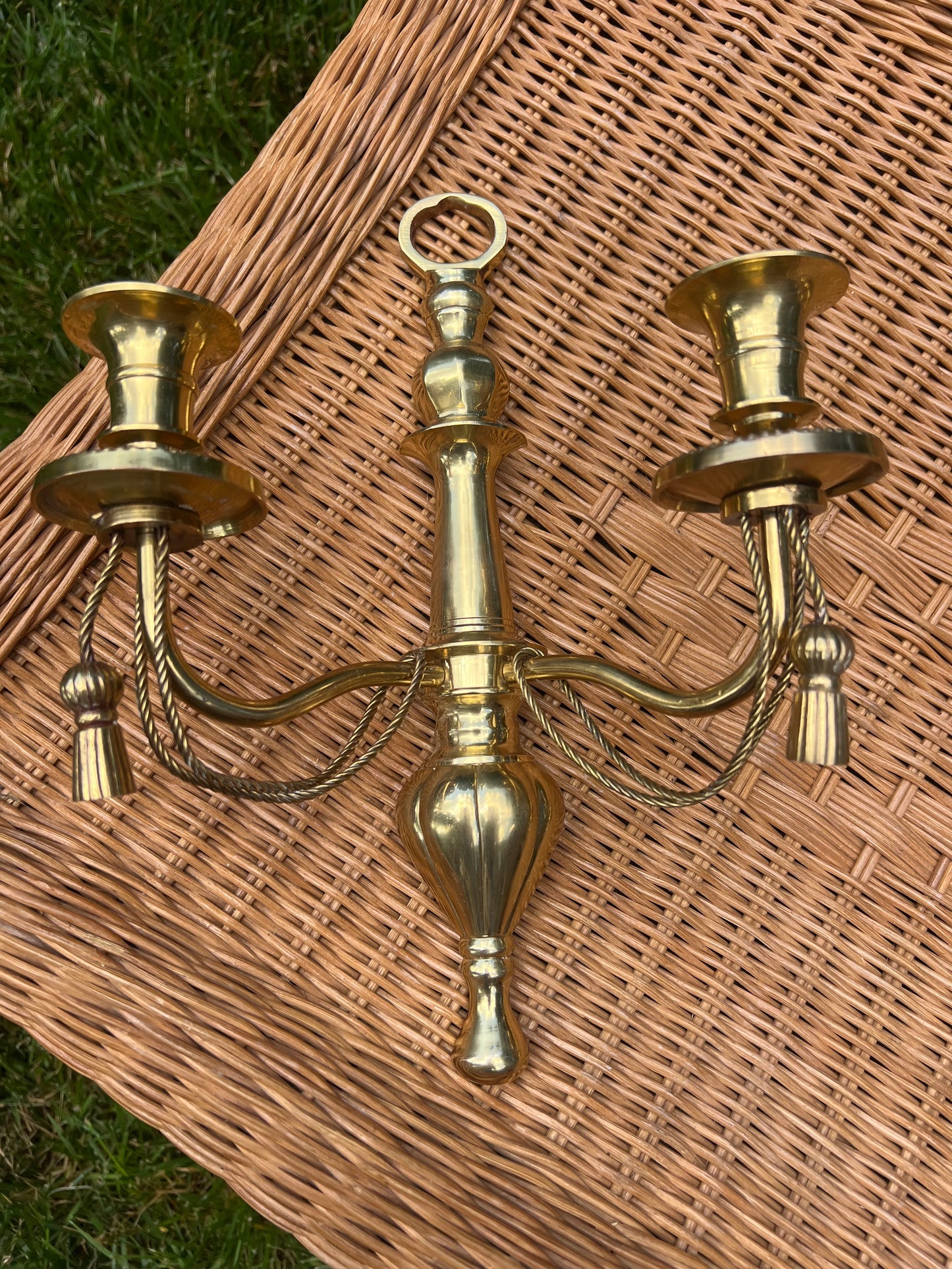 Pair of double arm brass braid and tassel candelabra wall sconces